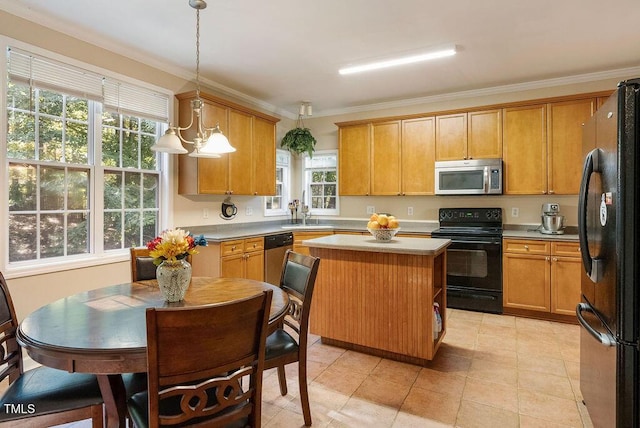 65 Applegate Dr, Franklinton, NC 27525 - kitchen featuring light countertops, crown molding, hanging light fixtures, and black appliances