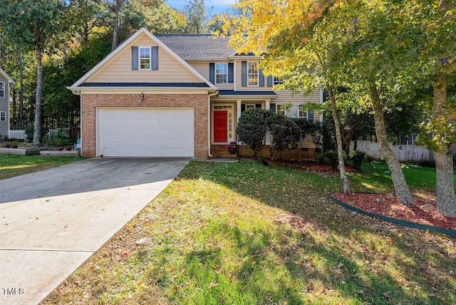 view of front of property with a front lawn and a garage