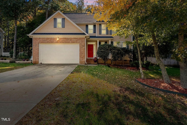 view of front facade featuring a yard and a garage