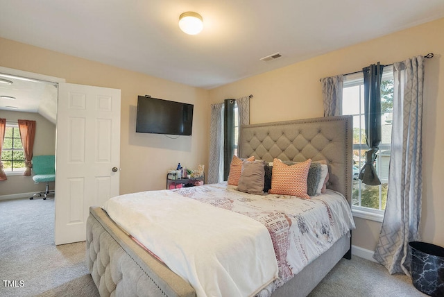 bedroom featuring light colored carpet