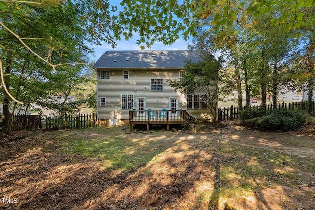 back of house featuring a deck