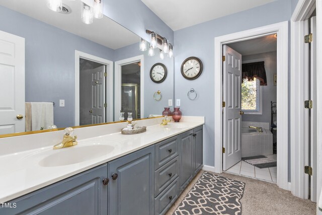 bathroom with vanity, independent shower and bath, and tile patterned floors