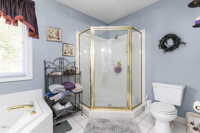 bathroom with independent shower and bath, toilet, and tile patterned floors