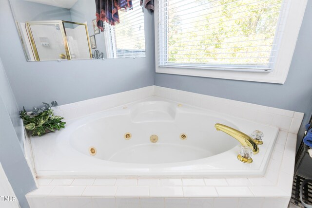 bathroom with a wealth of natural light and plus walk in shower