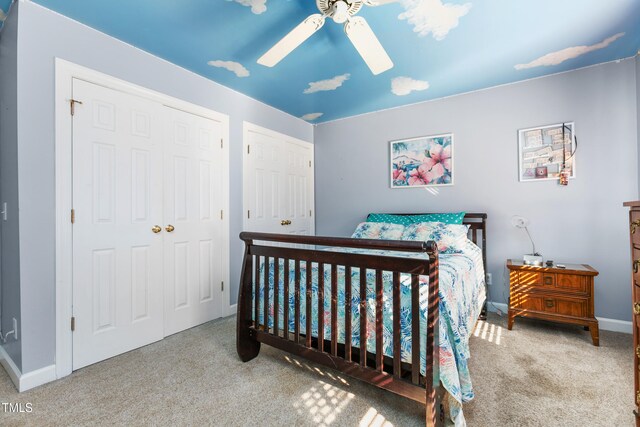 carpeted bedroom featuring ceiling fan