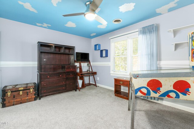 bedroom featuring light carpet and ceiling fan