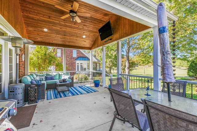 view of patio with outdoor lounge area and ceiling fan