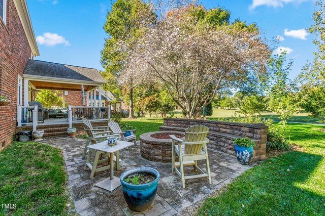 view of patio / terrace with a fire pit