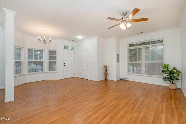 unfurnished living room featuring light hardwood / wood-style floors, ornamental molding, and ceiling fan with notable chandelier