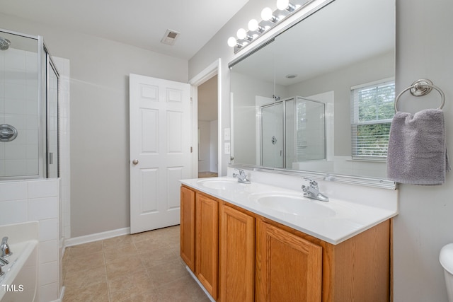 bathroom with vanity and independent shower and bath