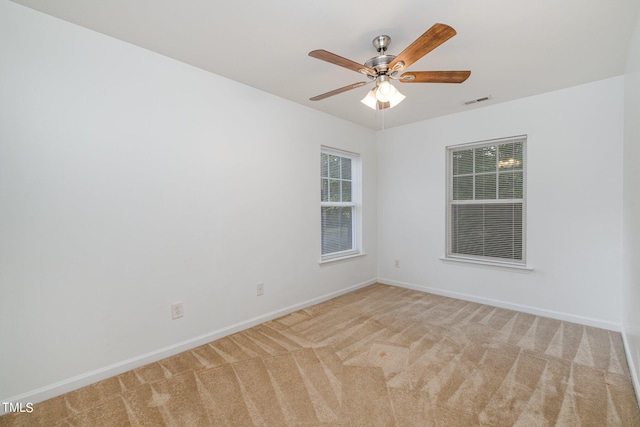 unfurnished room with carpet floors and ceiling fan