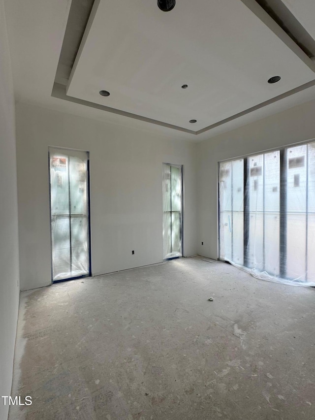 empty room with a raised ceiling