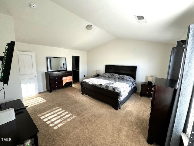 carpeted bedroom featuring vaulted ceiling