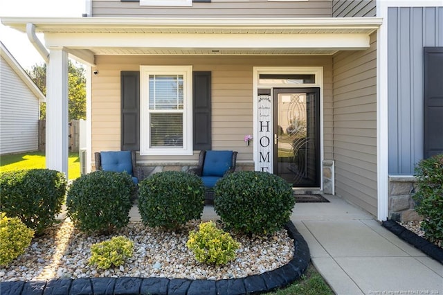 property entrance featuring covered porch