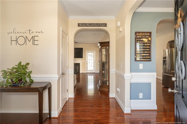 hallway featuring dark hardwood / wood-style floors and crown molding