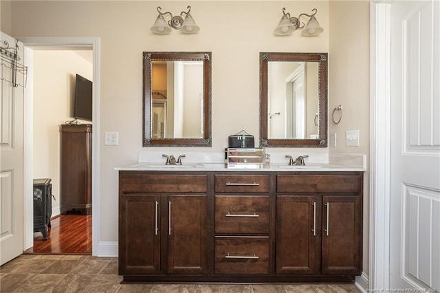 bathroom featuring hardwood / wood-style flooring and vanity