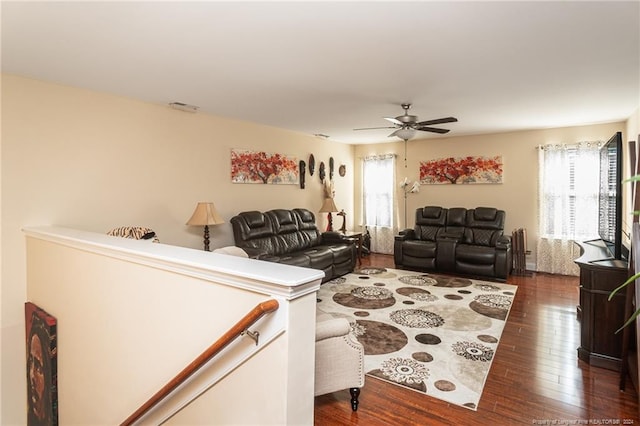 living room with ceiling fan, dark hardwood / wood-style floors, and a healthy amount of sunlight