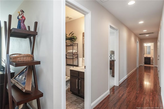 hall with dark hardwood / wood-style flooring