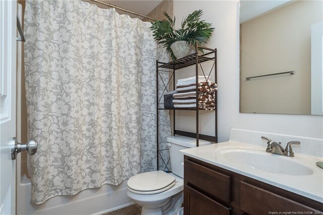 full bathroom with vanity, toilet, and shower / bathtub combination with curtain