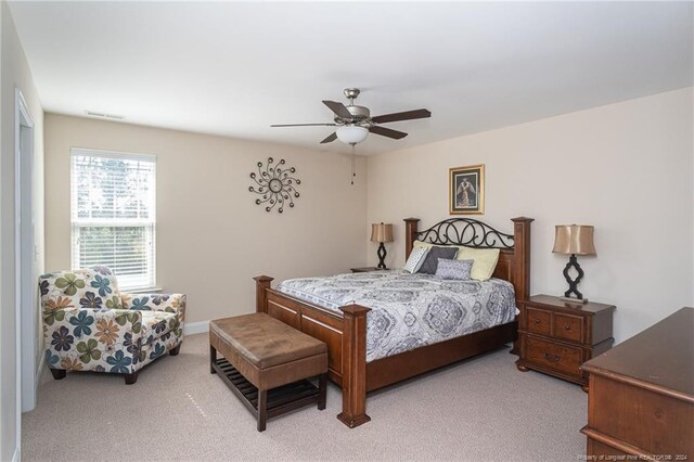 bedroom with light colored carpet and ceiling fan