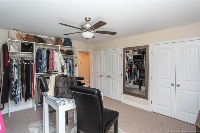 office space with carpet and ceiling fan