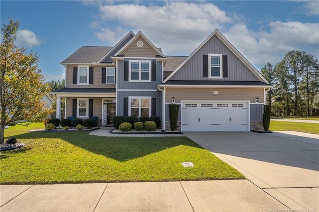 view of front of property featuring a garage and a front lawn