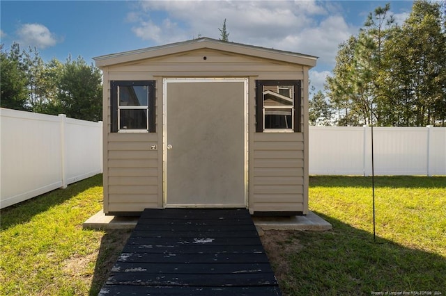 view of outdoor structure featuring a yard