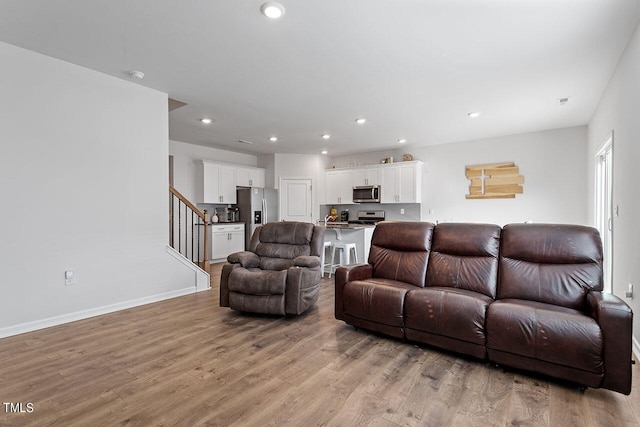 living room with light hardwood / wood-style flooring