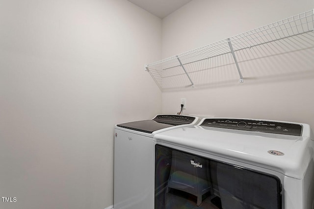 laundry room with washing machine and dryer