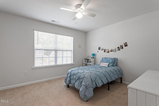 carpeted bedroom with ceiling fan