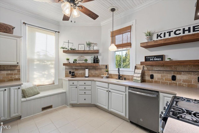 kitchen with backsplash, appliances with stainless steel finishes, and a healthy amount of sunlight