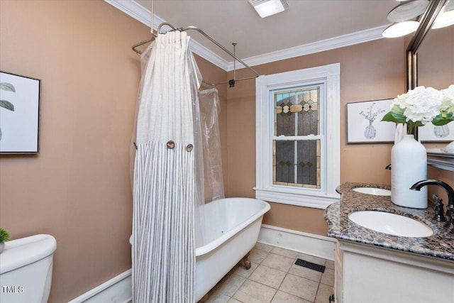 bathroom with crown molding, tile patterned floors, vanity, and toilet