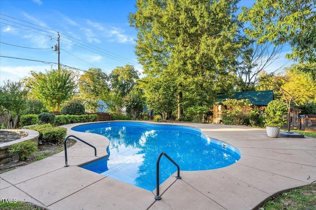 view of pool featuring a patio