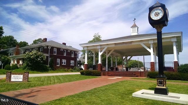 surrounding community with a gazebo and a yard