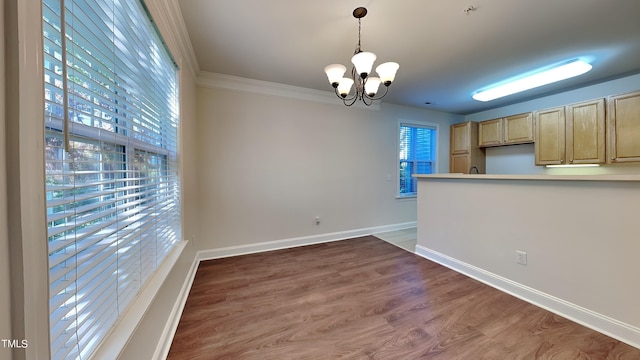 1414 Arborgate Cir, Chapel Hill, NC 27514 - unfurnished dining area featuring a chandelier, baseboards, wood finished floors, and ornamental molding