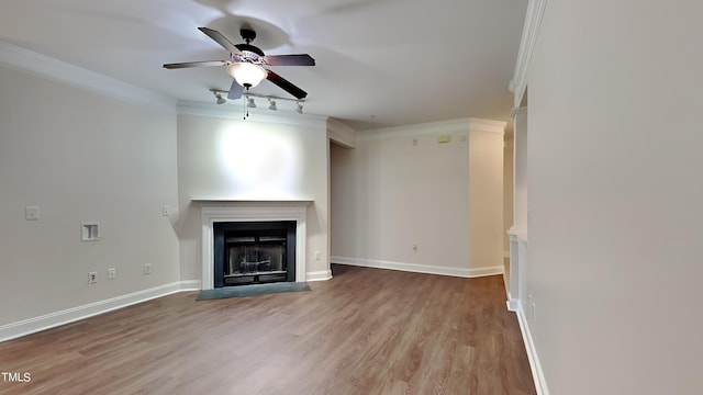 unfurnished living room with ornamental molding, light hardwood / wood-style flooring, and ceiling fan