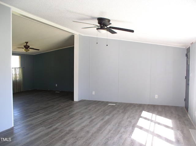 empty room with hardwood / wood-style floors, a textured ceiling, and ceiling fan