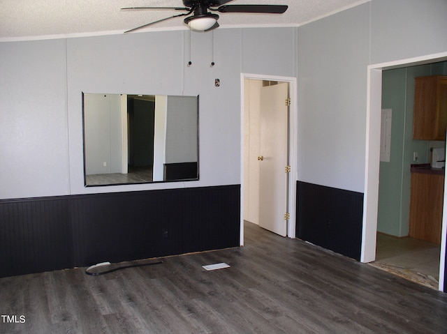 spare room with ceiling fan, a textured ceiling, ornamental molding, and hardwood / wood-style floors