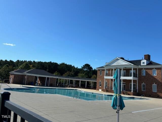 view of pool featuring a patio