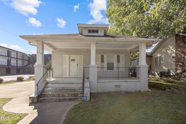 bungalow-style home featuring a front yard and a porch