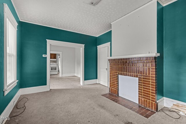 810 E Edenton St, Raleigh, NC 27601 - unfurnished living room featuring a textured ceiling, a fireplace, carpet, and crown molding