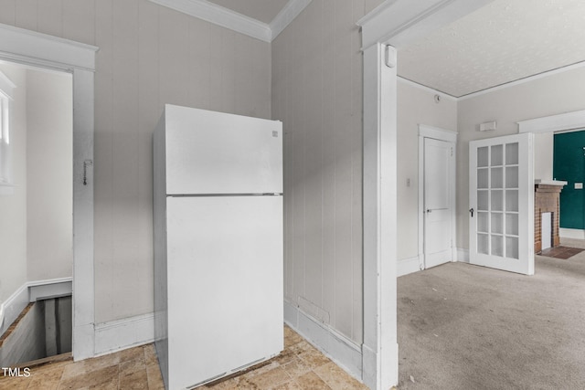 810 E Edenton St, Raleigh, NC 27601 - kitchen with freestanding refrigerator, crown molding, and stone finish flooring