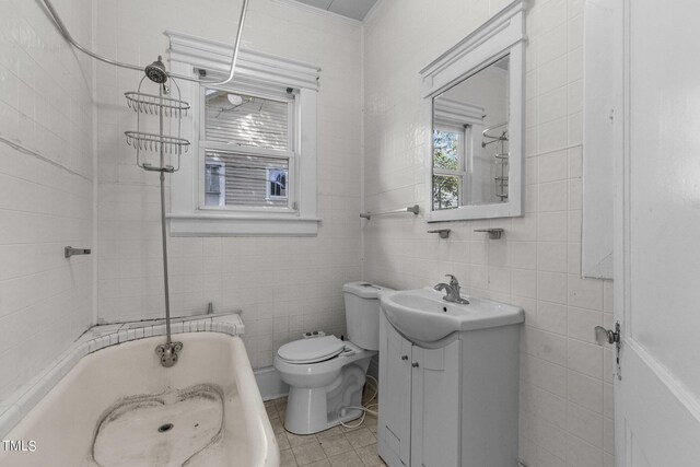 810 E Edenton St, Raleigh, NC 27601 - bathroom featuring vanity, tile walls, and shower / tub combination