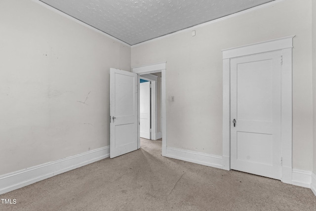 810 E Edenton St, Raleigh, NC 27601 - unfurnished room featuring carpet flooring, a textured ceiling, and ornamental molding