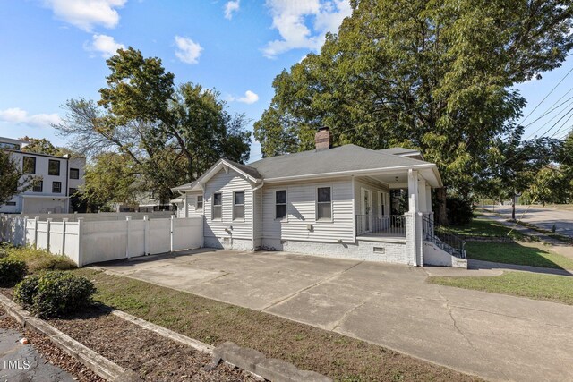 810 E Edenton St, Raleigh, NC 27601 - view of front of house featuring a chimney, crawl space, driveway, and a porch