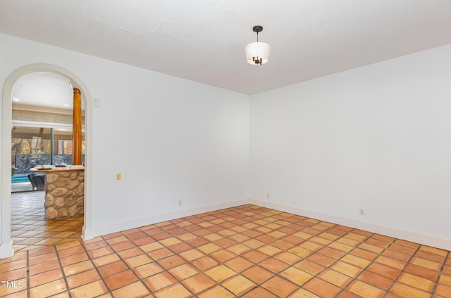 empty room with light tile patterned floors