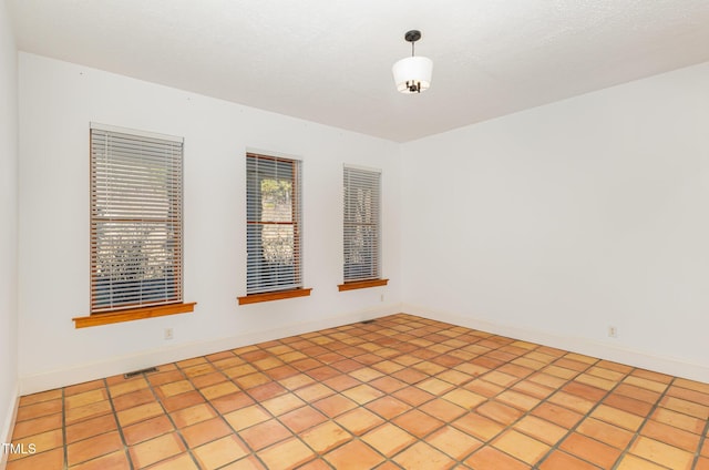 view of tiled spare room