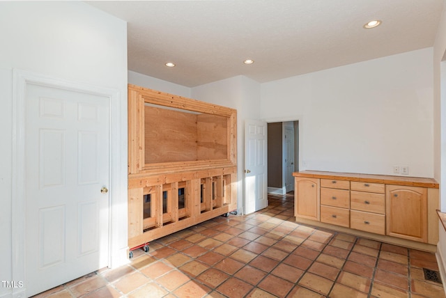 unfurnished bedroom featuring tile patterned floors