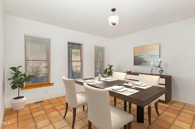 dining area with light tile patterned flooring