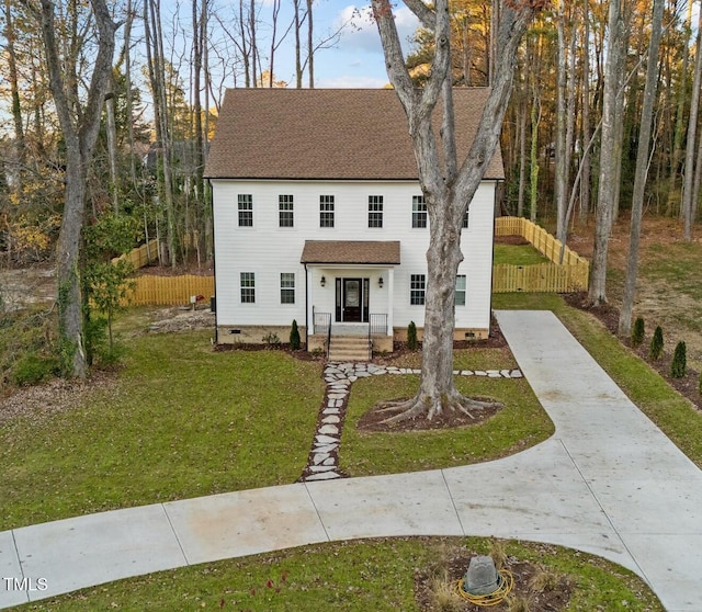 colonial inspired home with a front yard